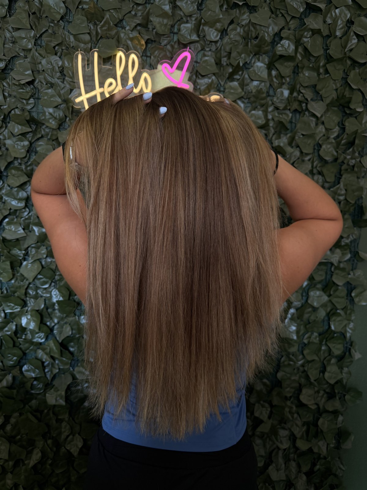 Blonde dimensional balayage on darker base, signature backdrop.